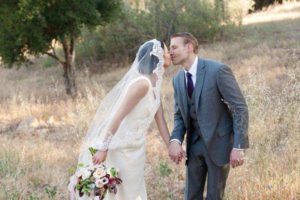 Bride & Groom happy kissing