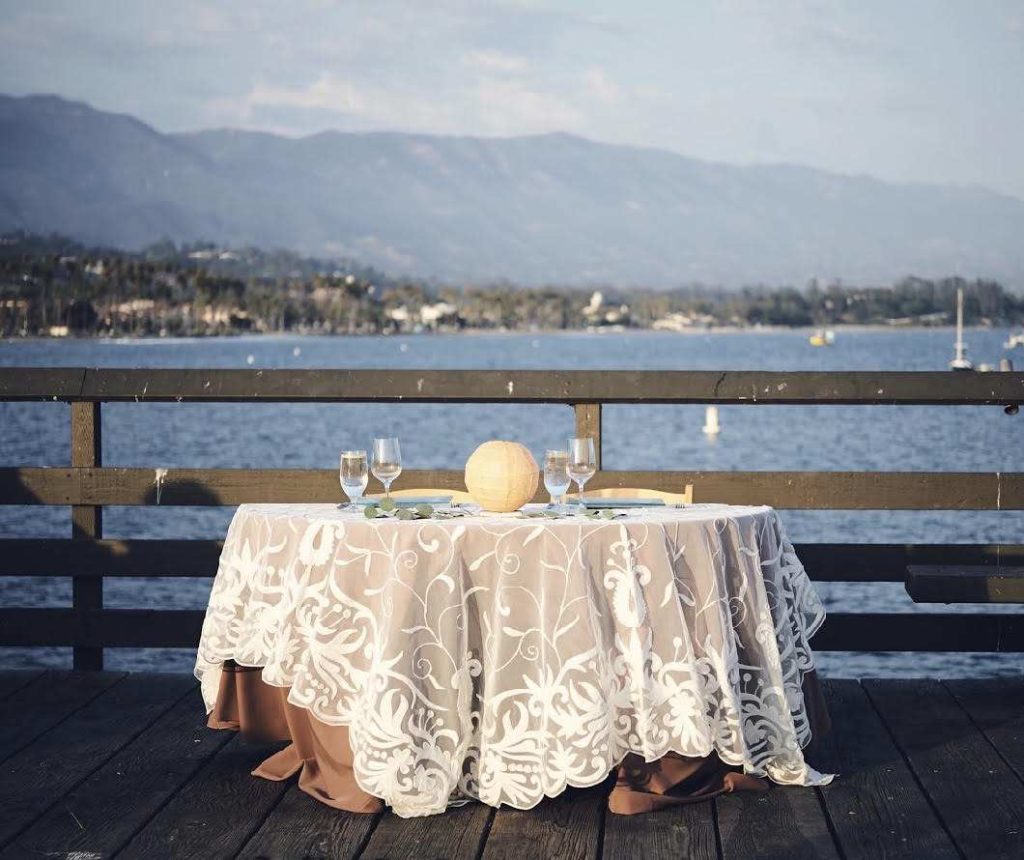 Decorated outdoor table for wedding by the ocean catered by Catering Connection.