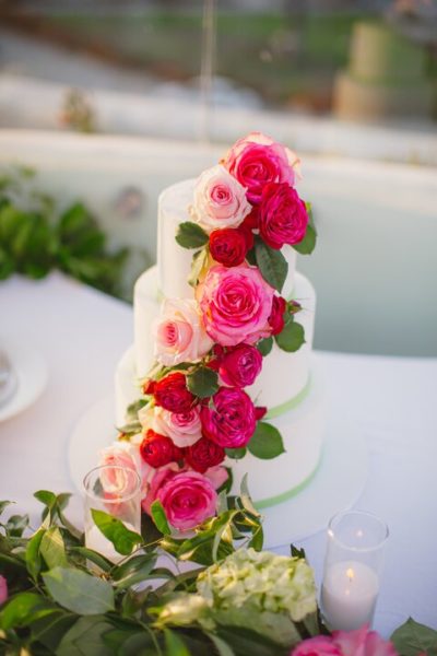 Wedding cake with roses trailing down the side.