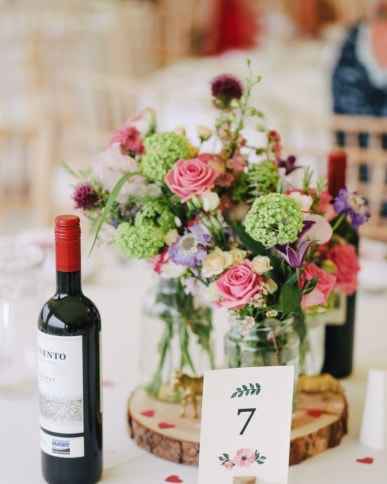 bottle of wine and flowers provided by the caterer