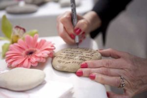 sign-in-rocks-with-pen-flower